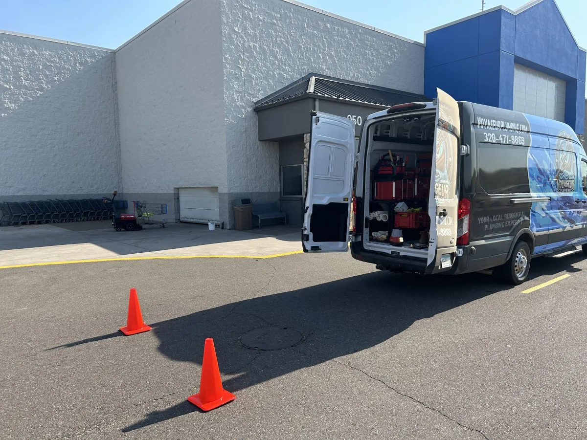 Crew in front of plumbing van