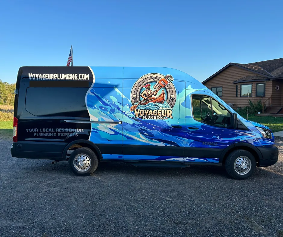 Plumbing van in front of residential home.