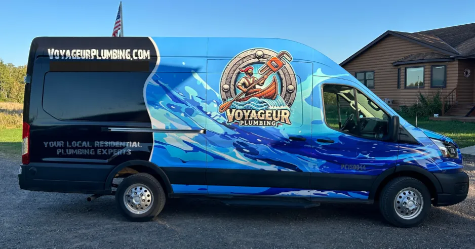 Plumbing van in front of residential home.