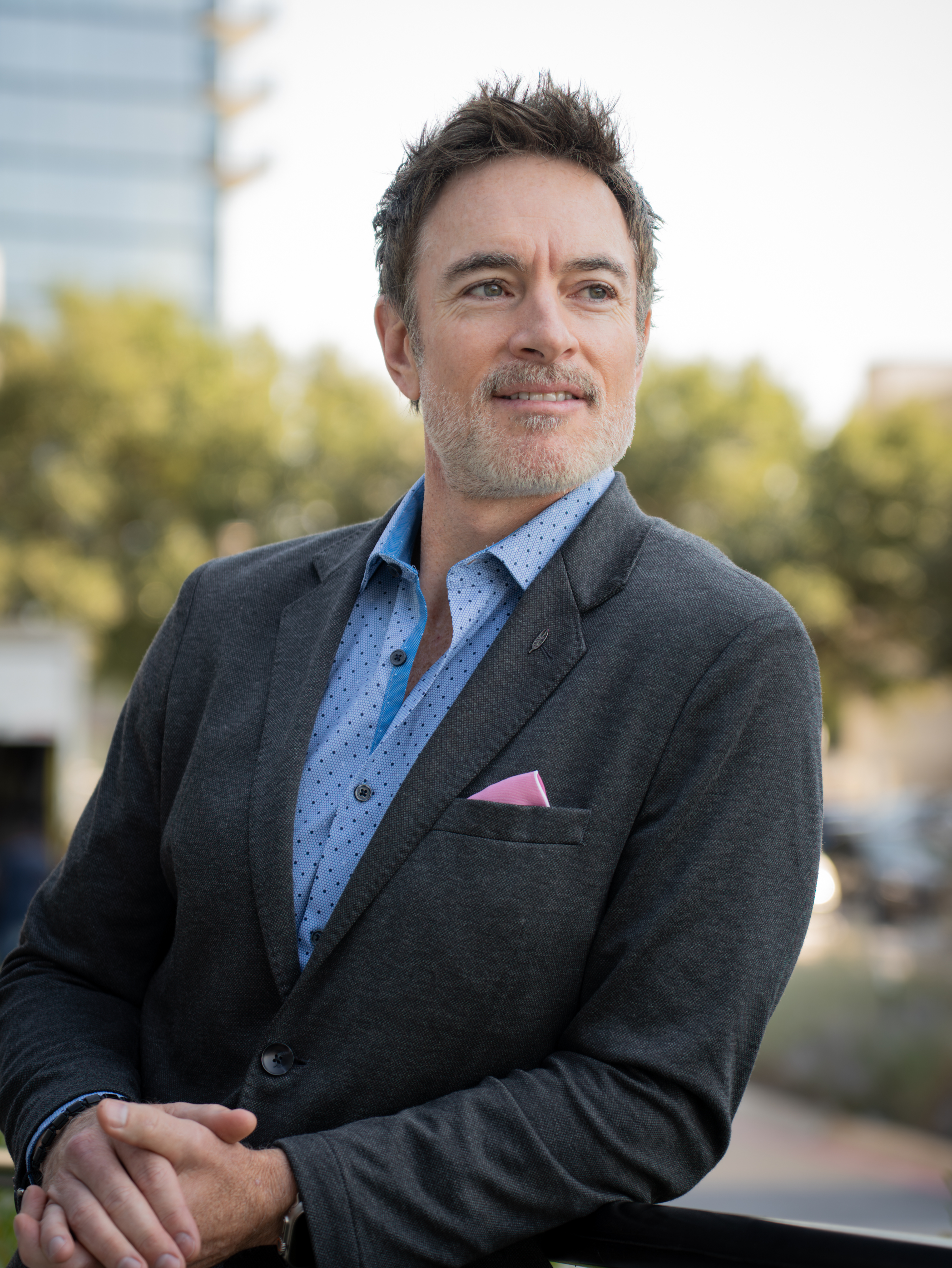 silhouette photo of man on cliff during sunset