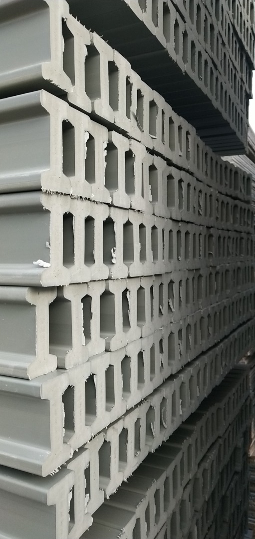 Construction workers assembling plastic formwork for slabs, highlighting modular construction solutions