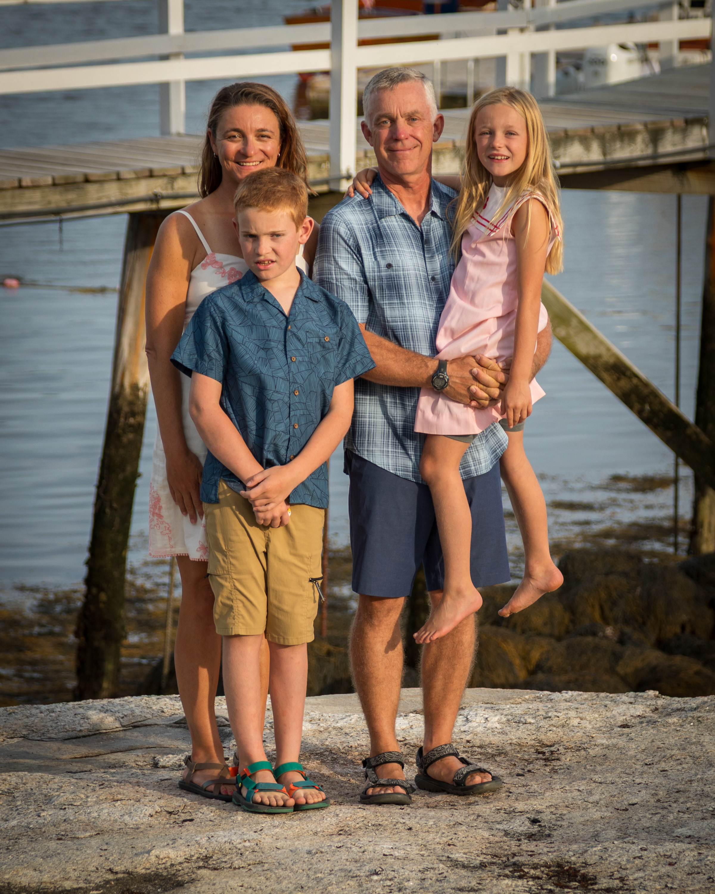 Veteran-owned GO Bin Cleaners founder Mark McCormick standing with his family outdoors