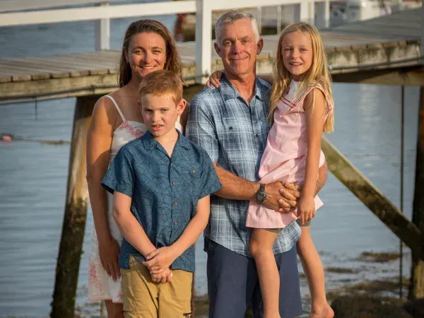 Veteran-owned GO Bin Cleaners owner pictured with family outdoors