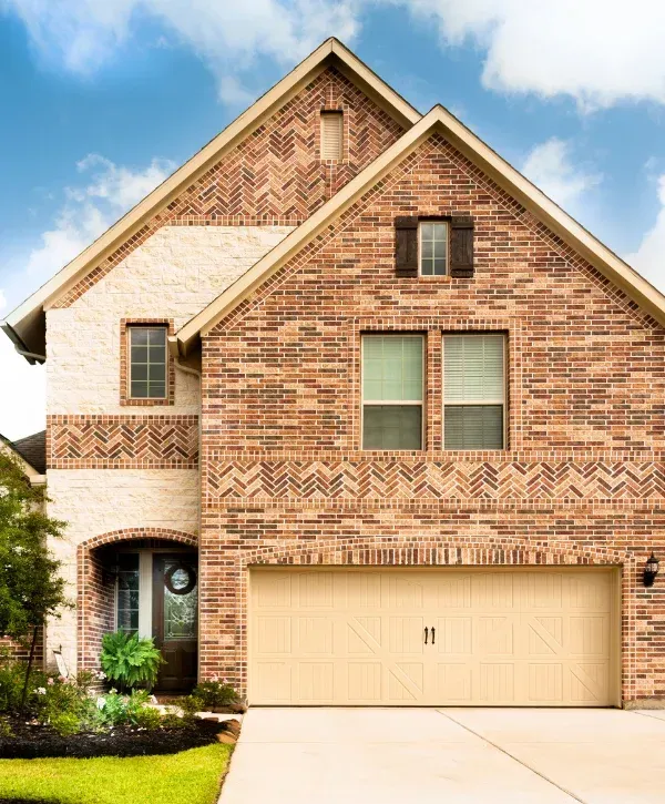 Clean brick home exterior after professional pressure washing service