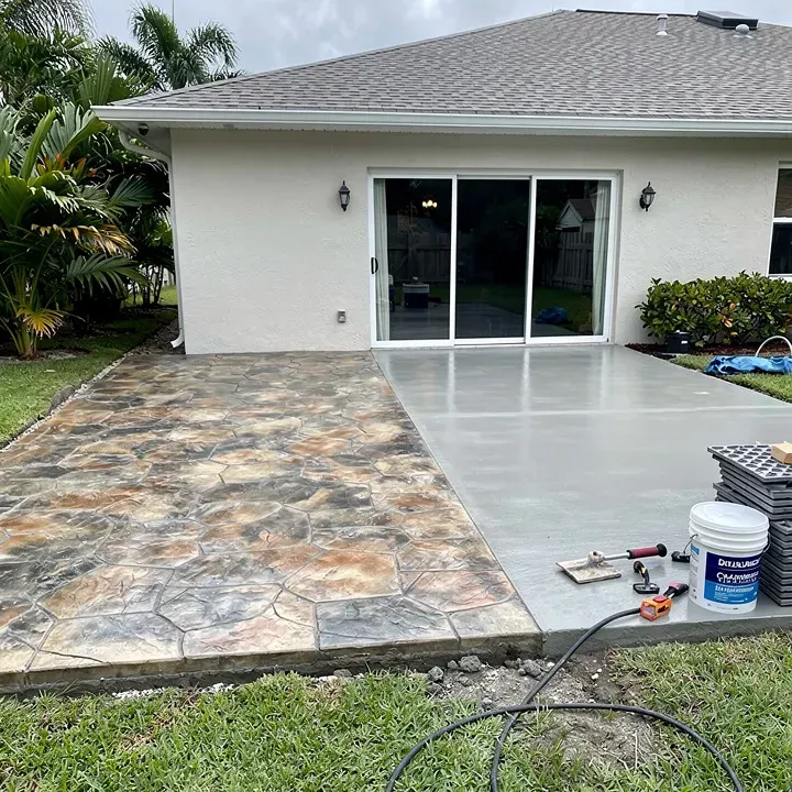Stamped concrete patio showing half completed stamped section and half unfinished concrete in Lake Worth Florida