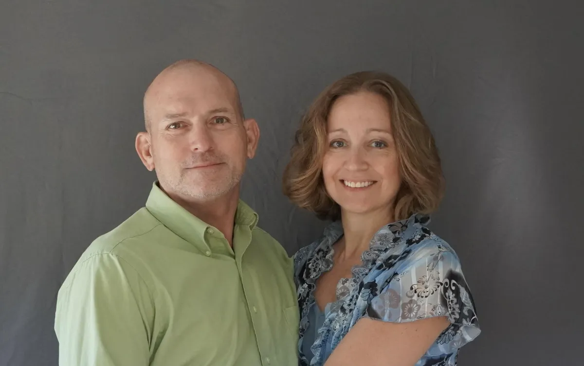 Friendly real estate team meeting with a client in a cozy living room