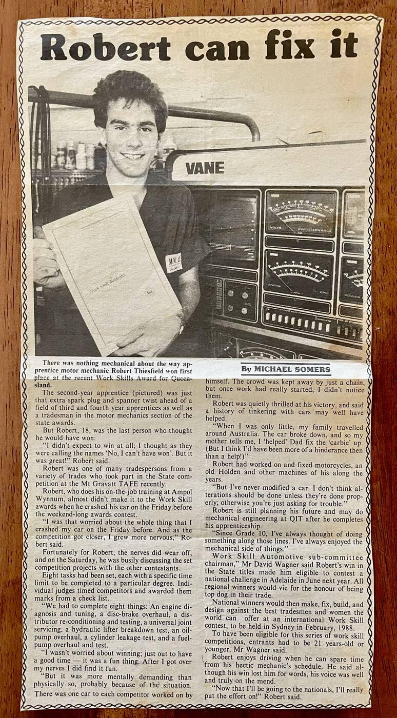 Newspaper clipping "Robert can fix it": Rob Thiesfield, aged 18, holding his Work Skills award in a workshop