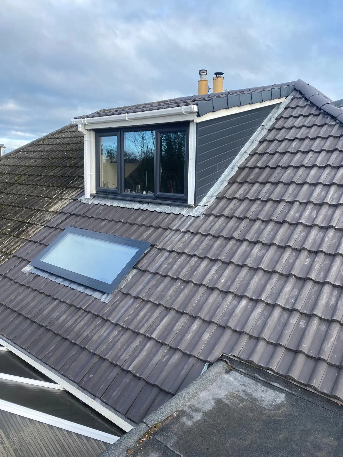 Roof preparing for repairs in Worcester by JF Roofers, showcasing expert preparation, including a newly installed skylight window, to restore roof integrity and ensure long-term protection.