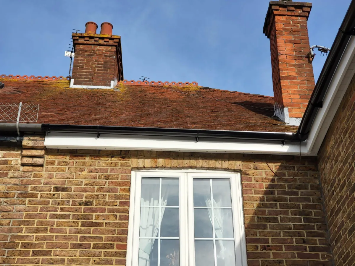 Roofer performing a flat roof repair, using professional tools and materials to ensure a durable and long-lasting roofing solution by JF Roofers.