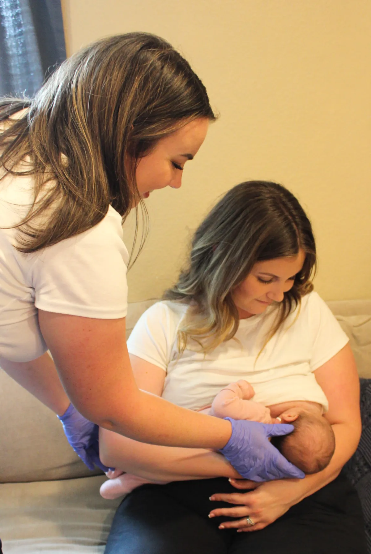 Mother holding her newborn after a positive birth experience