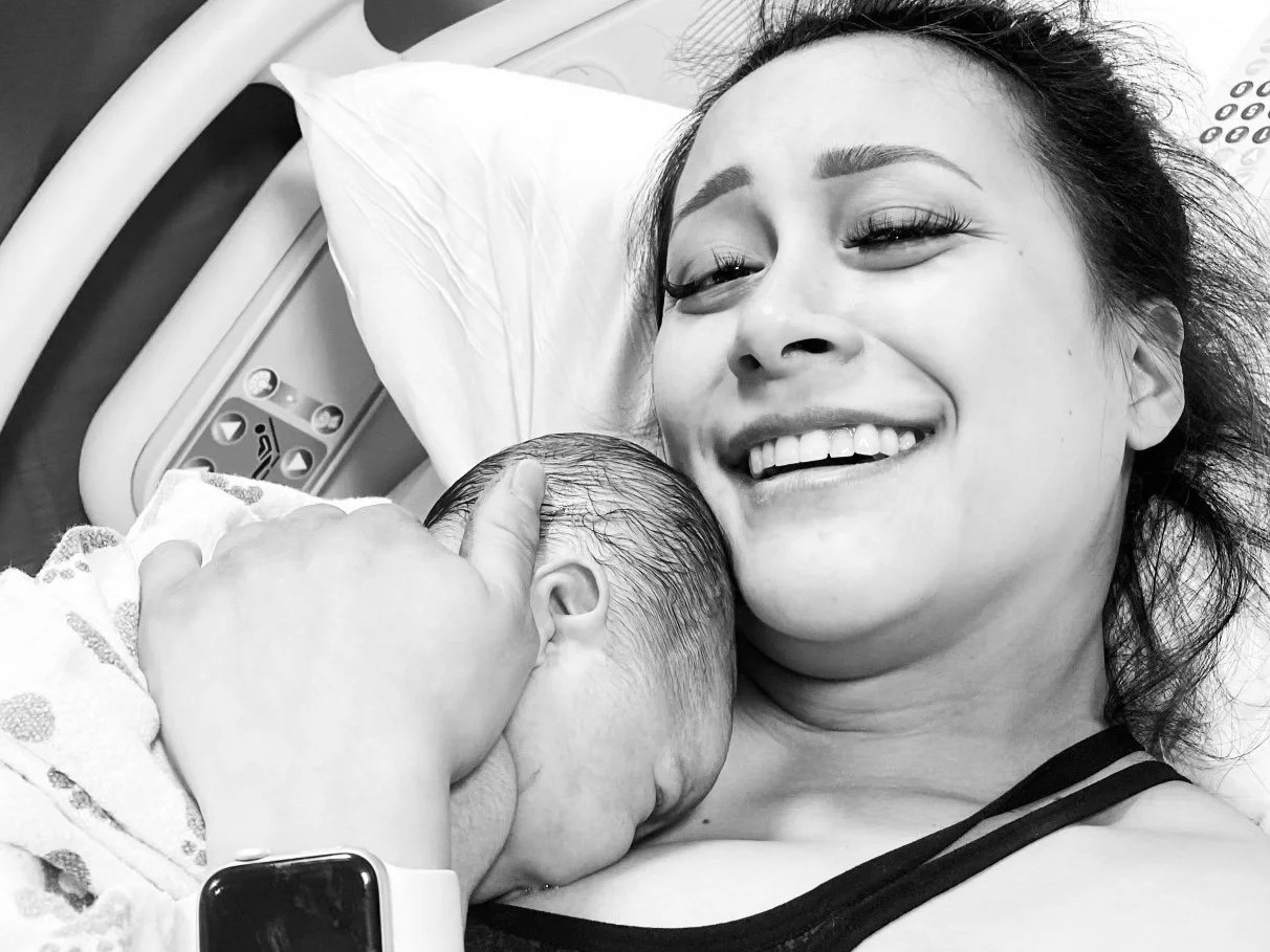 Birth doula providing emotional and physical support during labor
