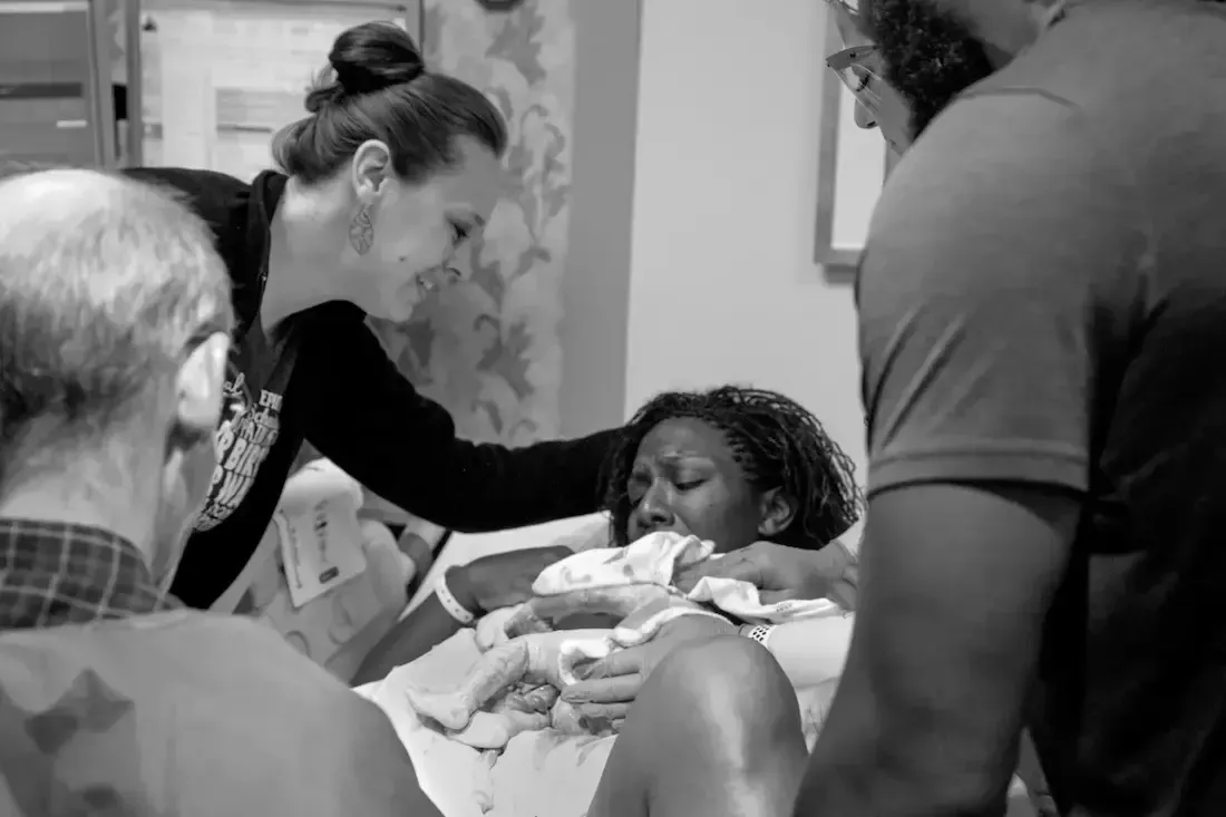 Birth doula using hands-on comfort techniques during labor