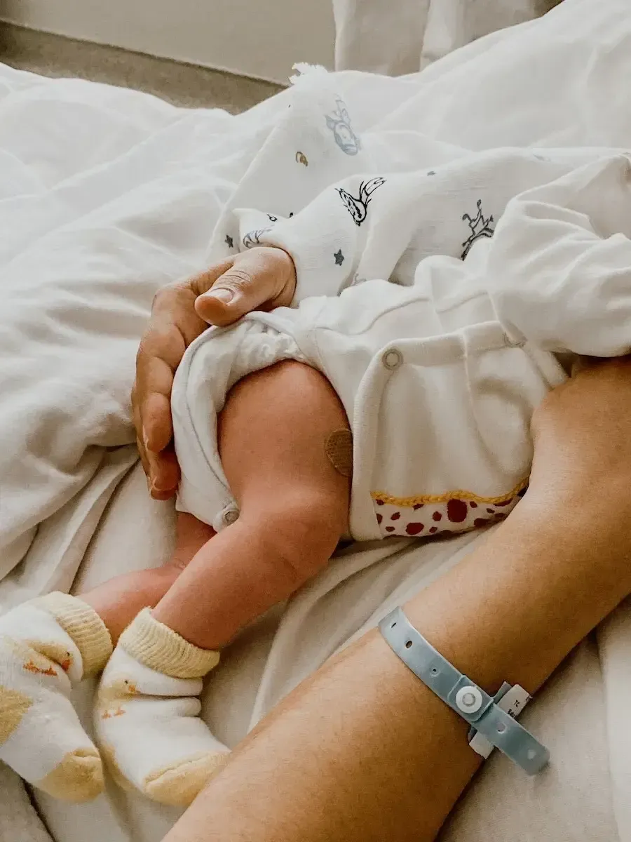 Postpartum doula supporting a mother and newborn during the fourth trimester