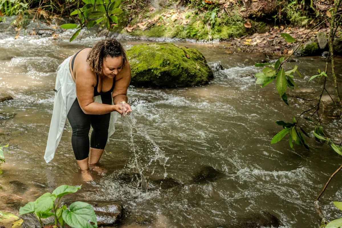 Woman enjoying the cooling river ater