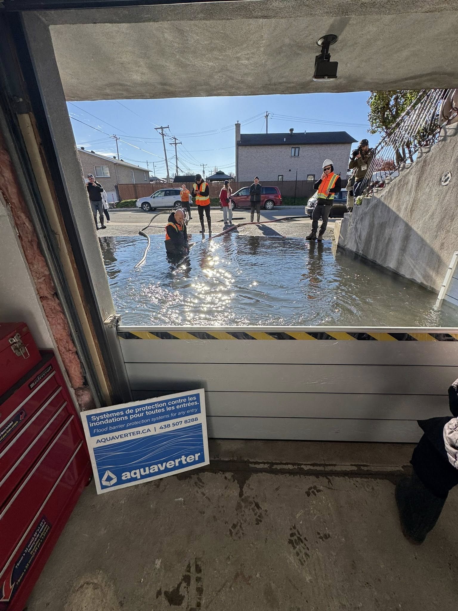 Lab test setup showing AquaShield panels under simulated six-foot water pressure with instrumentation