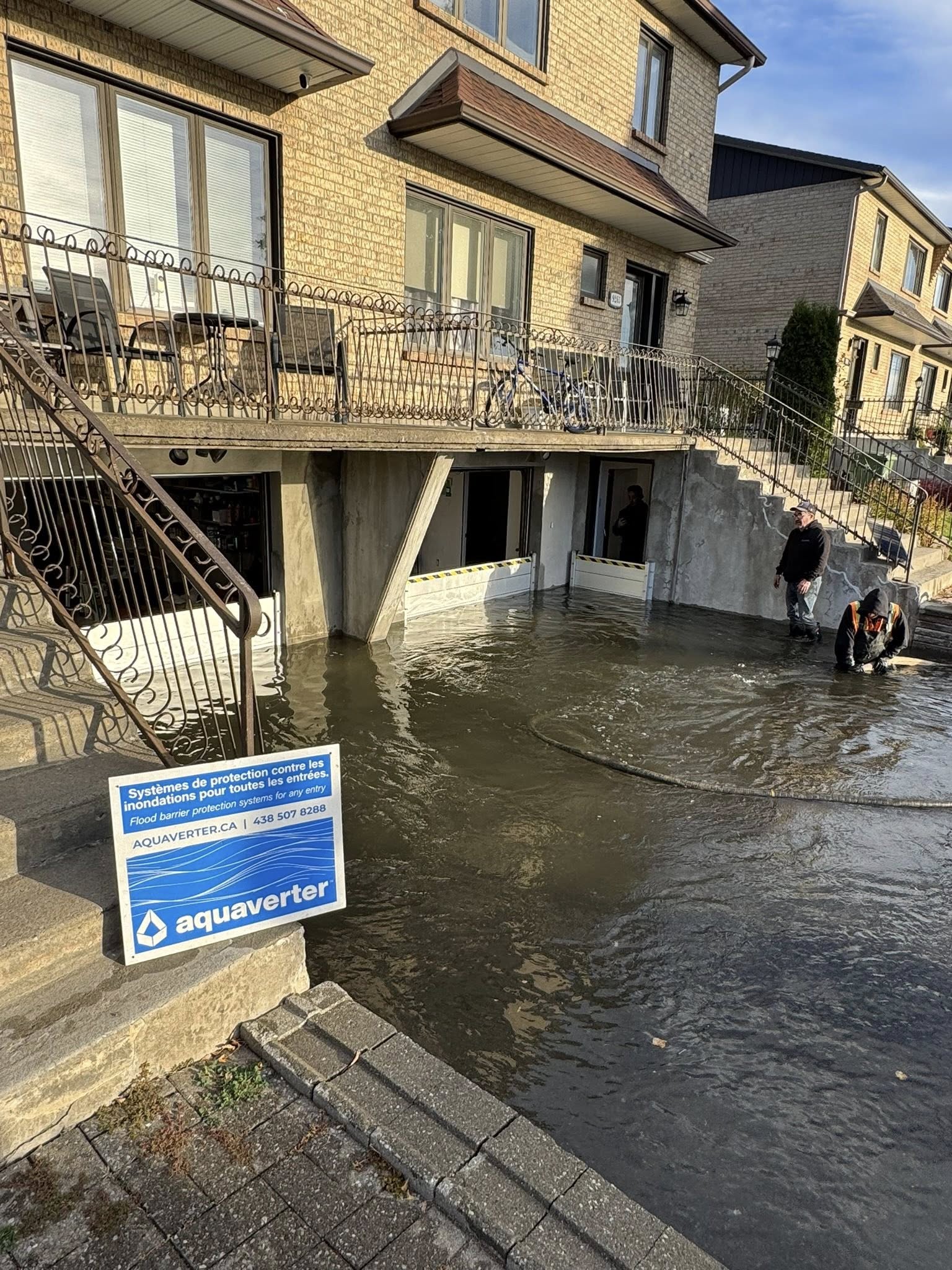 Lab test setup showing AquaShield panels under simulated six-foot water pressure with instrumentation