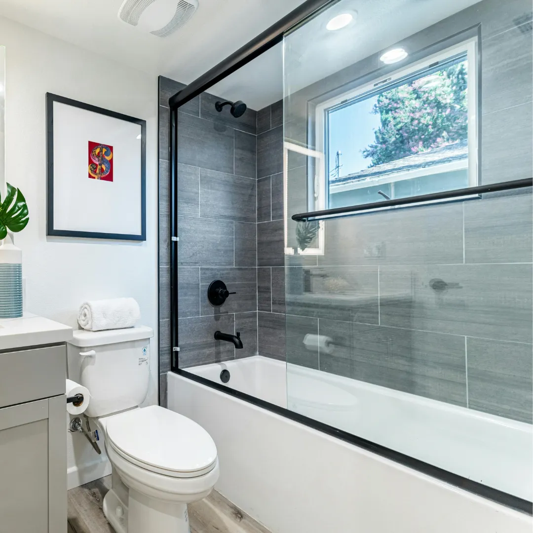 Luxury bathroom remodel with freestanding soaking tub walk in shower custom vanity and tile flooring completed by expert remodelers