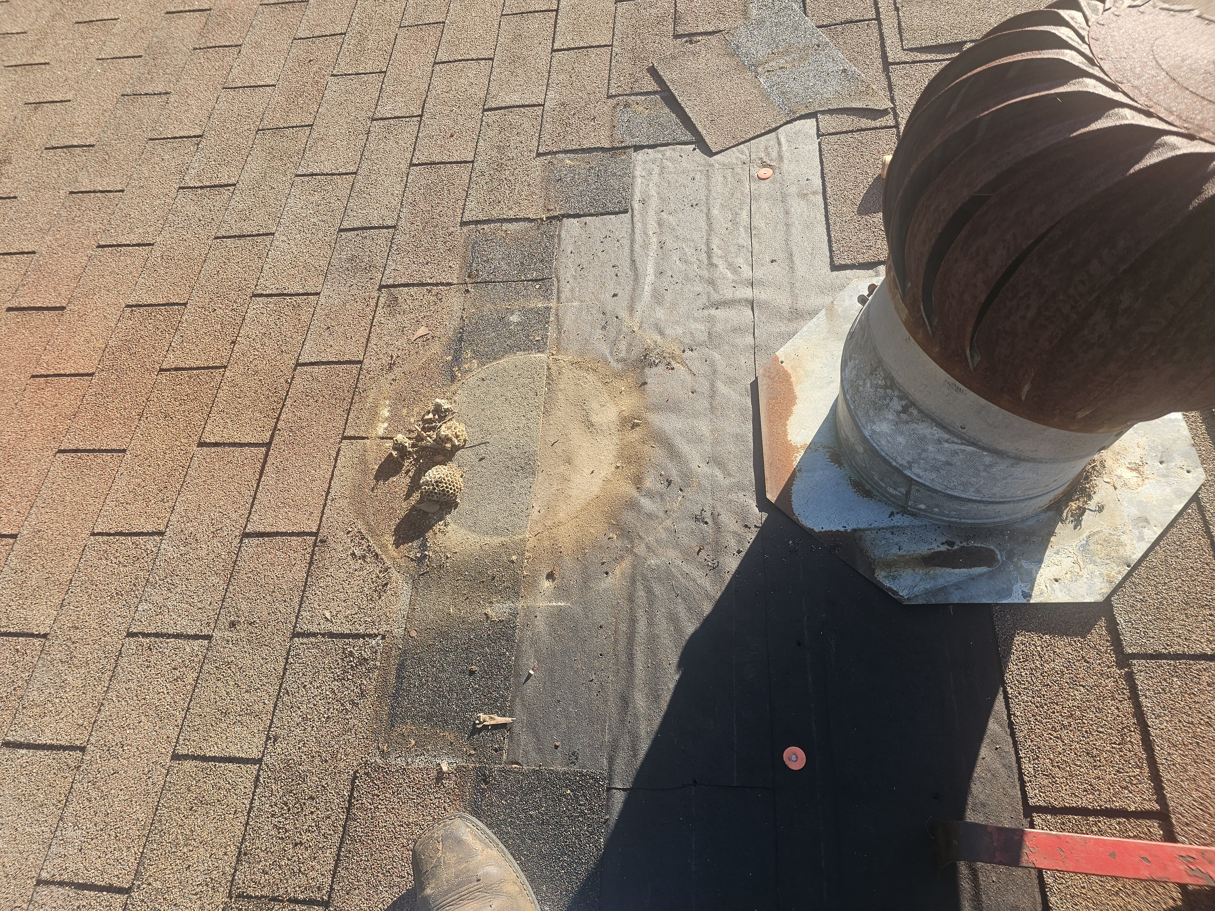 Removal of wind turbin exposed tar paper not cut holding heat in attic