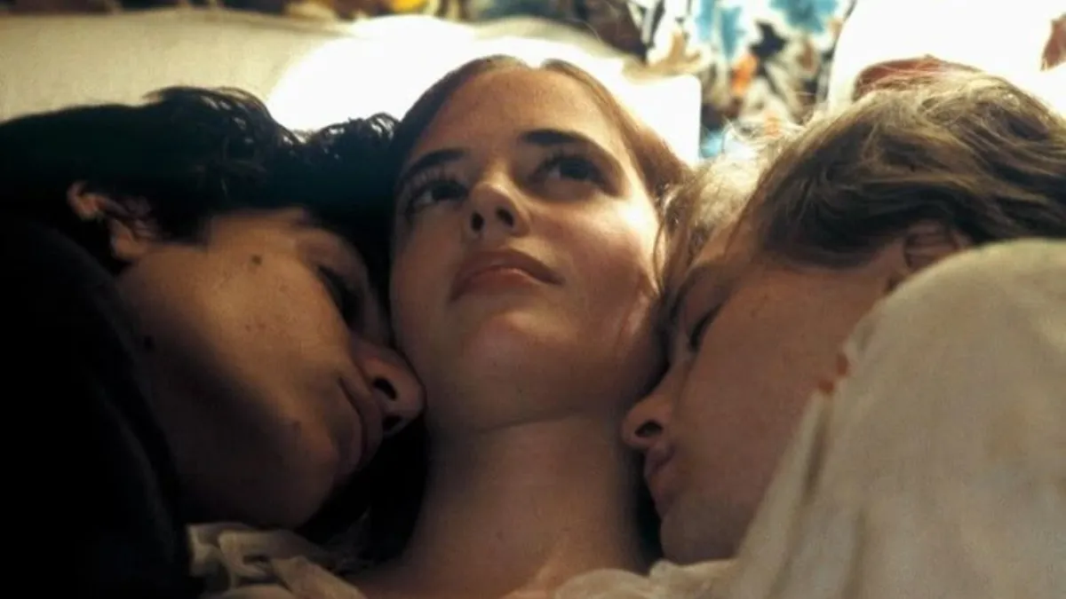 Intimate image of a woman resting between two lovers, visually evoking the emotional and erotic themes in Her Secret Garden, as featured in The Juicy Times by Fruit & Flowers.
