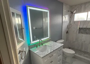 bathroom remodel with backlit led mirror