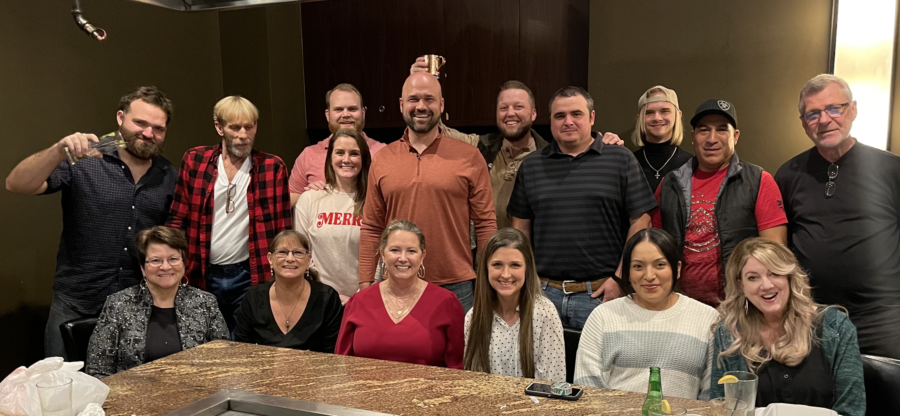 A picture of the Albright Roofing team, 16 total, at our 2022 Christmas party at Kawa's, an Asian restaurant in Tyler, TX.