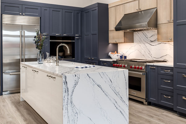 Alexandria Kitchen & Bath Remodel team designing an open-concept kitchen with elegant lighting and island seating