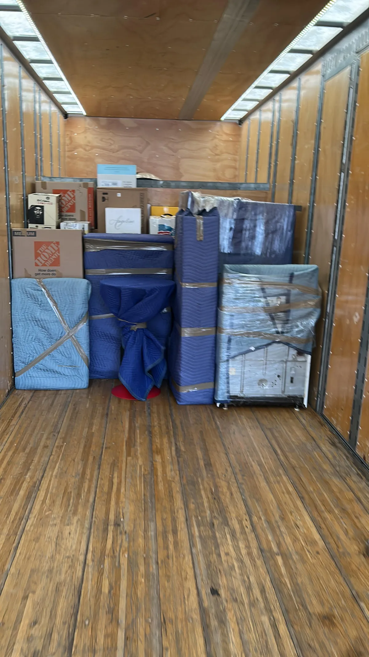 Local moving service loading boxes into a truck