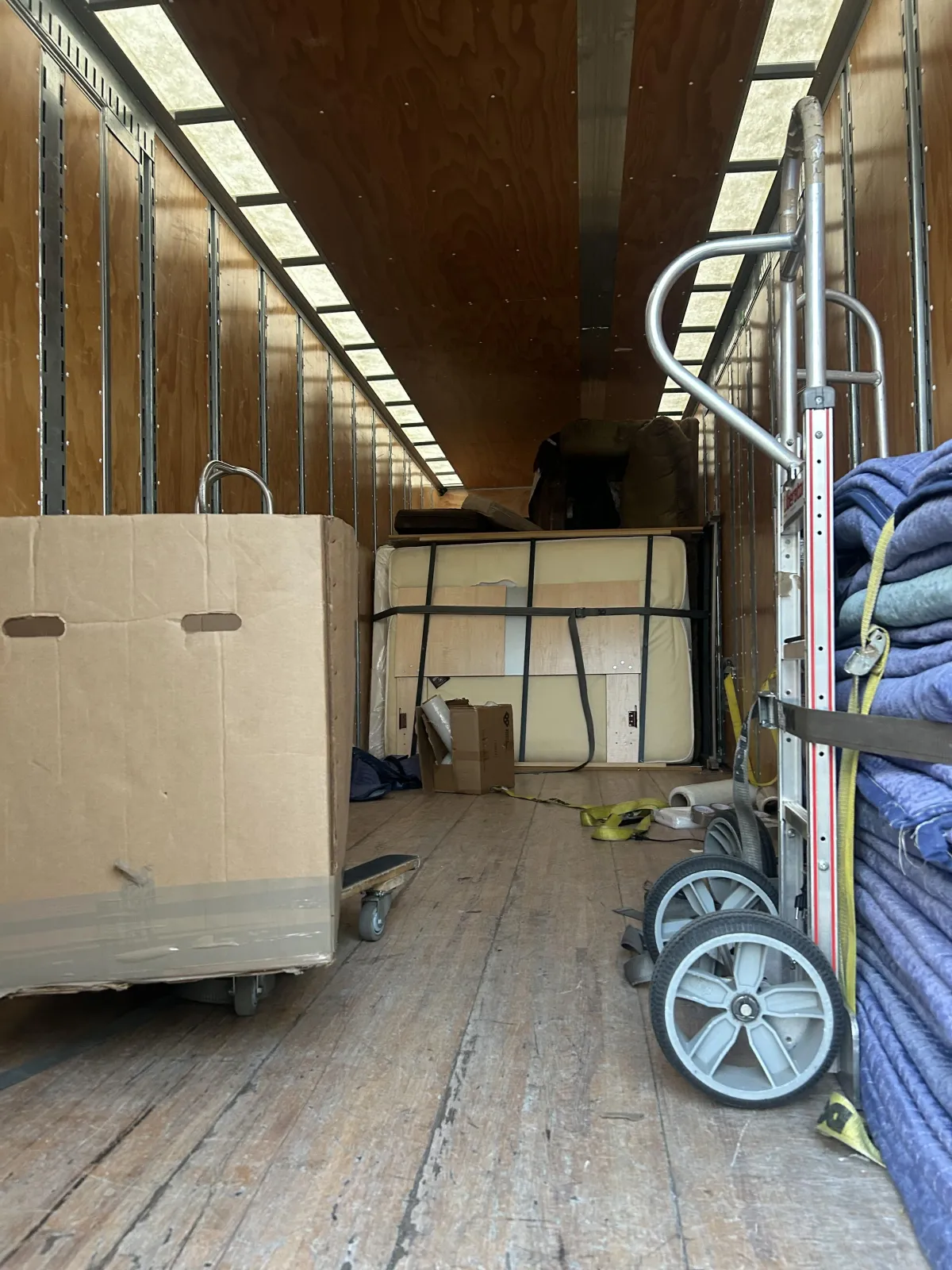 Apartment move with movers carrying furniture