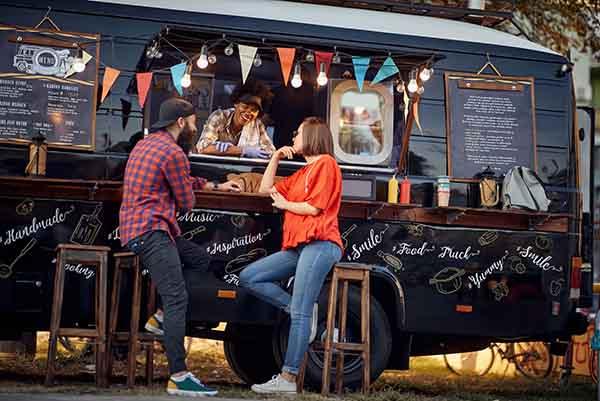 Image of popular food trucks showcased on the Always Local app, promoting a variety of local street food options, staff, and vibrant dining experiences.