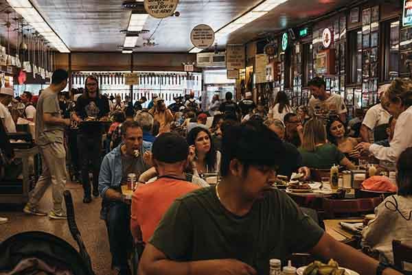 Image of happy customers enjoying local venues, featured on the Always Local app to promote vibrant dining and social experiences at bars, restaurants, breweries, and food trucks.