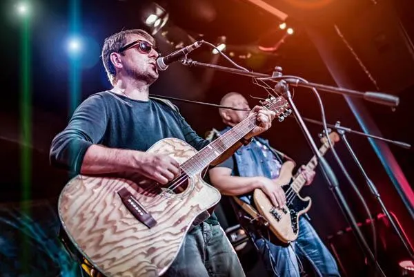 Image of live entertainment at a local venue, featured on the Always Local app, showcasing musicians and performers enhancing the dining and social experience at bars, restaurants, and breweries.