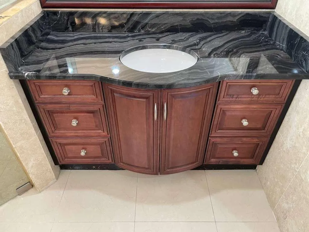 man holding incandescent bulb