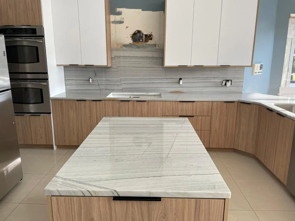 woman holding white mug while standing