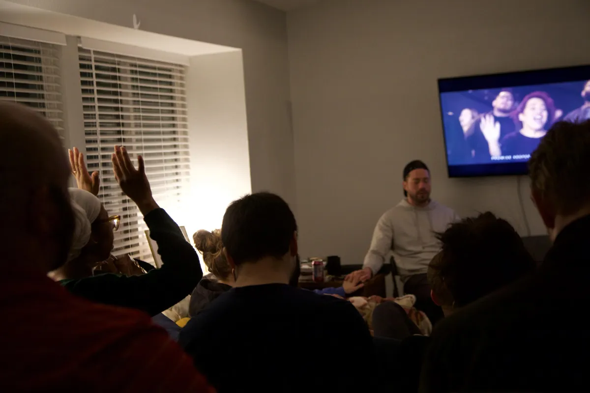 Small group worshipping together