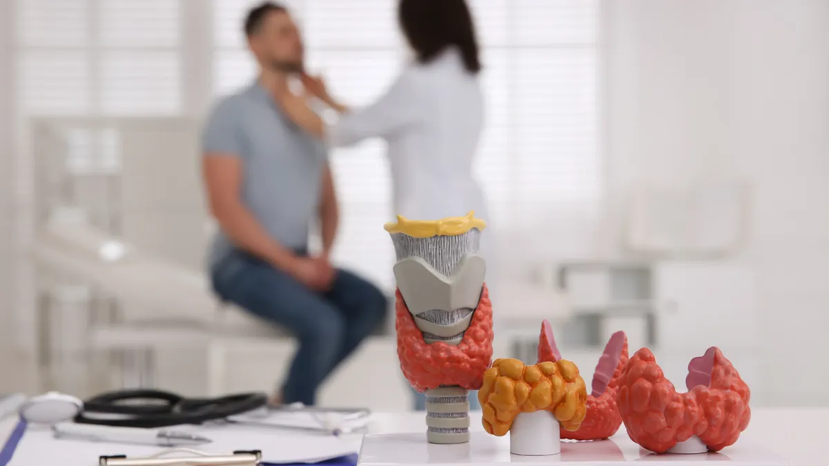 Man with allergies holding tissue