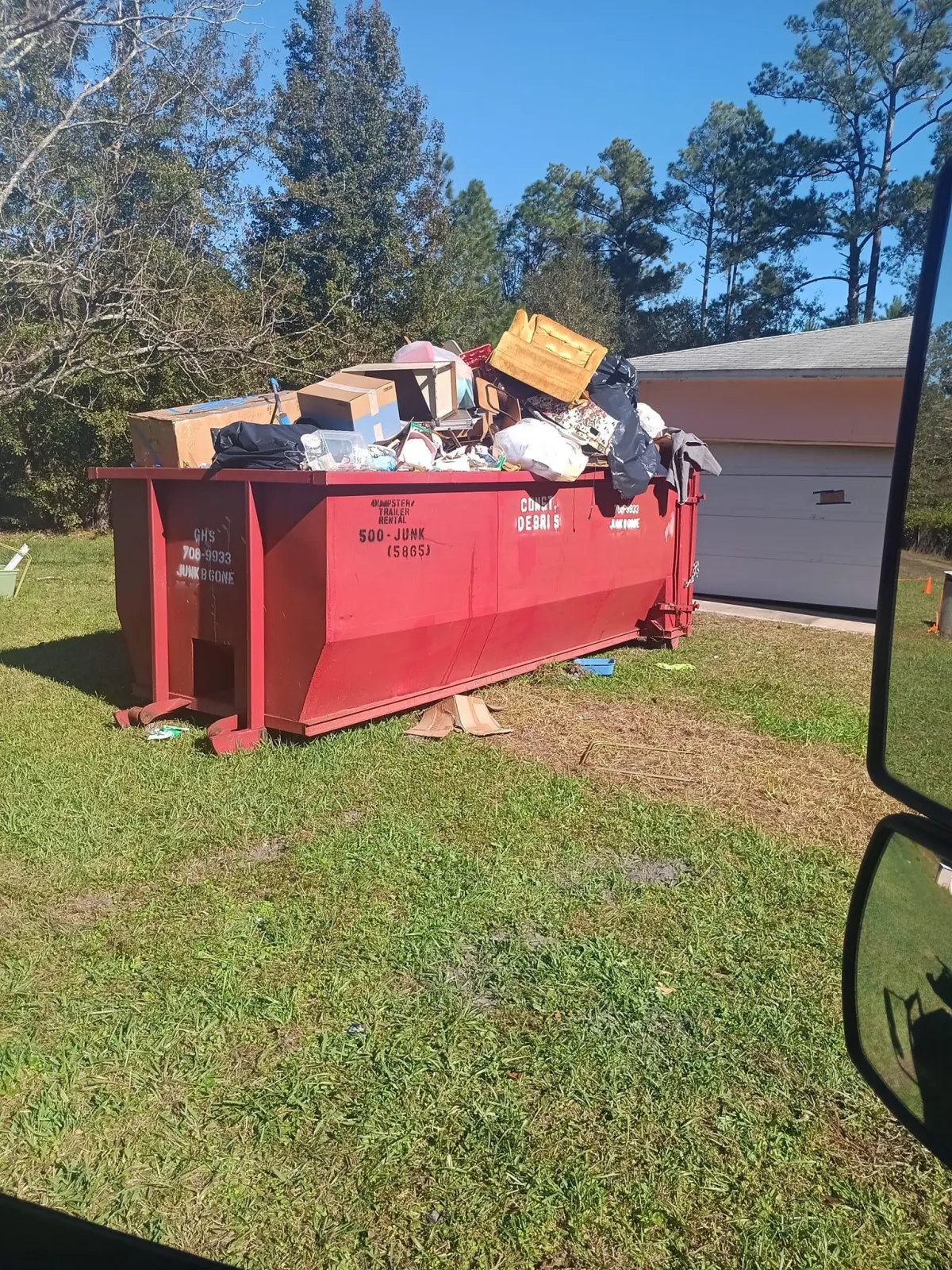 GHS Home Services Dumpster Rental Full of Trash
