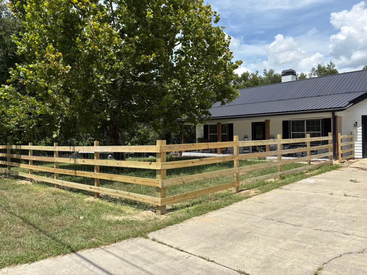 A close up of a metal fence with a blue sky in the background