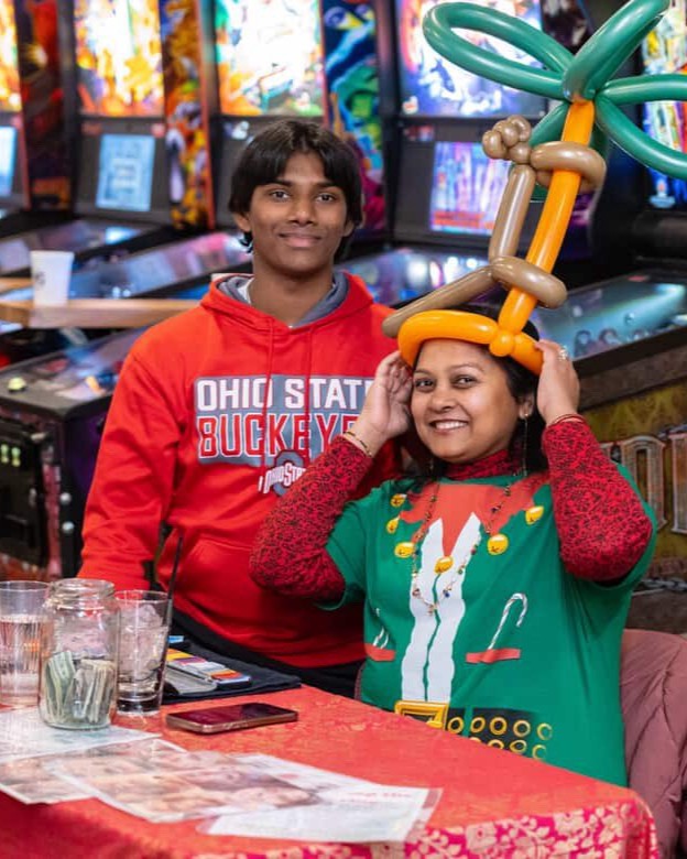 Ishan, Lead Balloon Architect for Aria Face Artistry, creating custom balloon sculptures in Central Ohio.