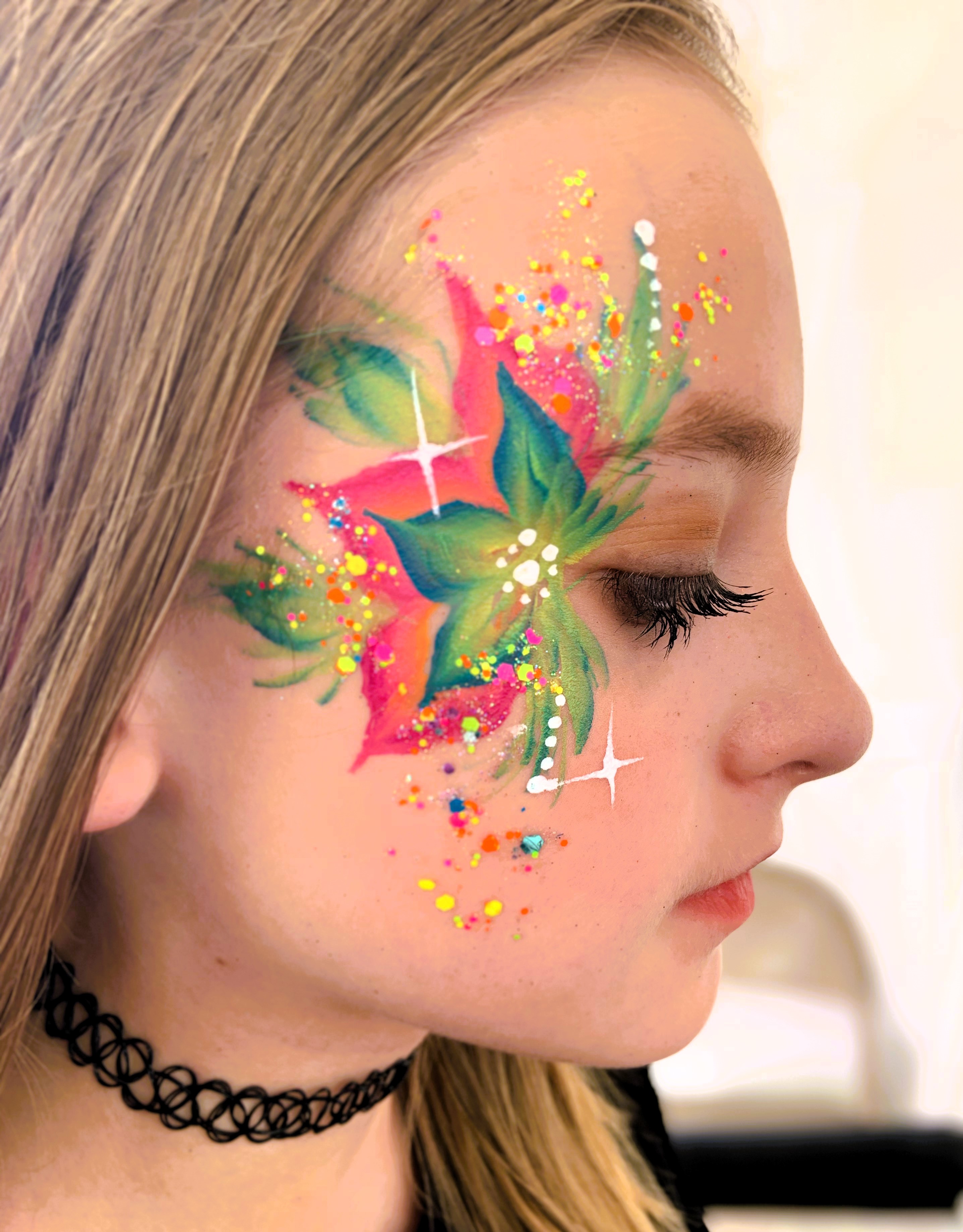 Sophisticated, detailed face paint designs for upscale events and festivals.