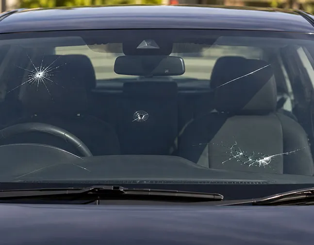 Car windscreen with multiple chips and cracks including a star break — damage Southern Auto Glass repairs in Wollongong