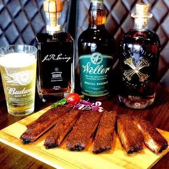 Full BarSlow-smoked dry rub ribs served with Budweiser draft and premium bourbons including Weller, Blanton’s, and J.R. Ewing at Link’s at Chaffee Crossing