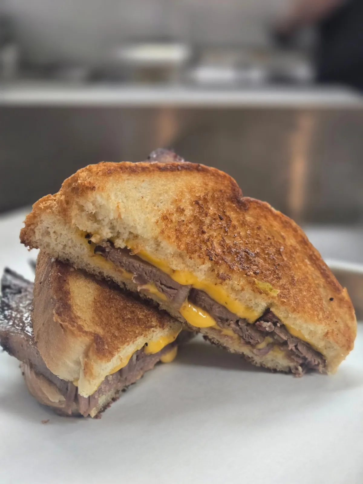 Texas toast grilled cheese stuffed with sliced brisket and melted cheddar at Link’s at Chaffee Crossing