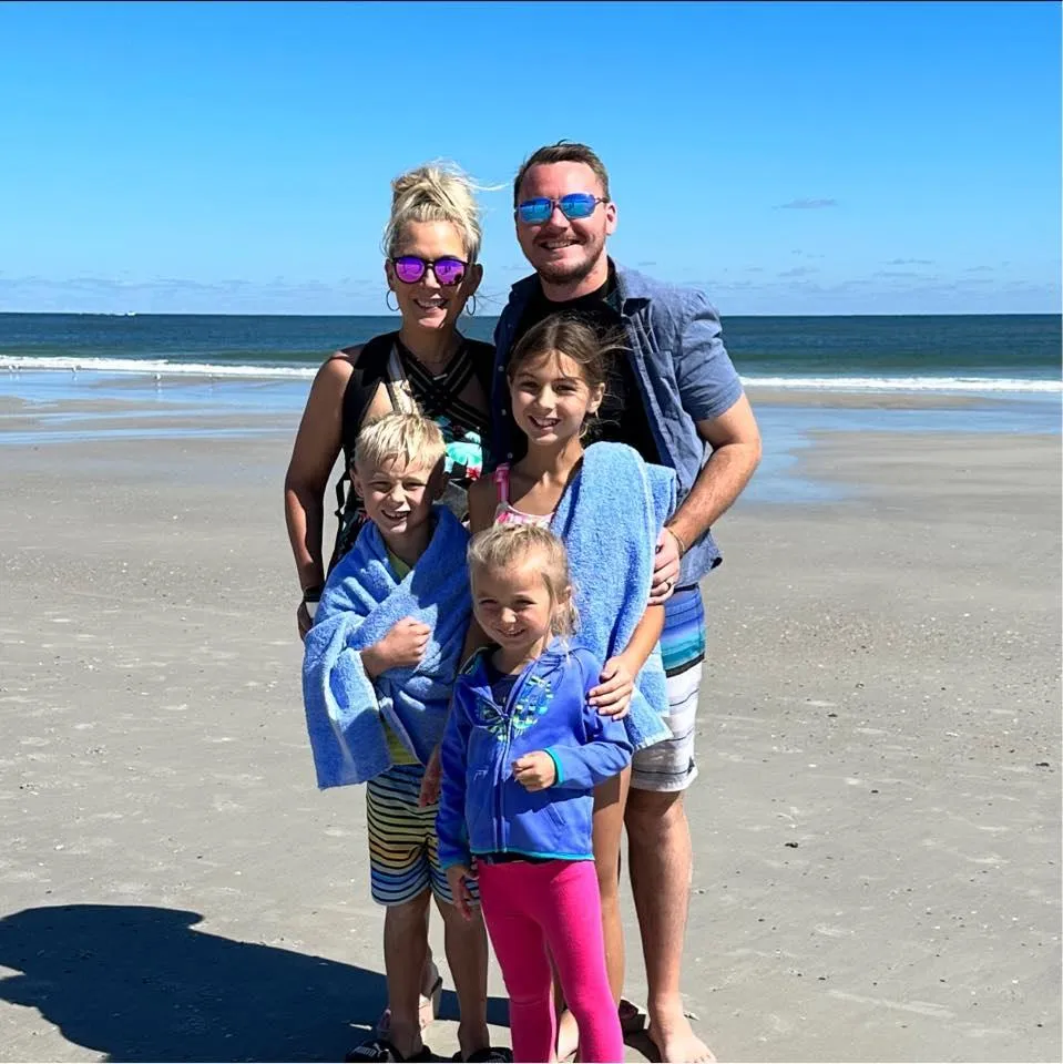 Portrait photo of a parent and child sharing a quiet moment, emotive storytelling shot, soft natural lighting, full-body or waist-up composition to evoke freedom and life benefits.