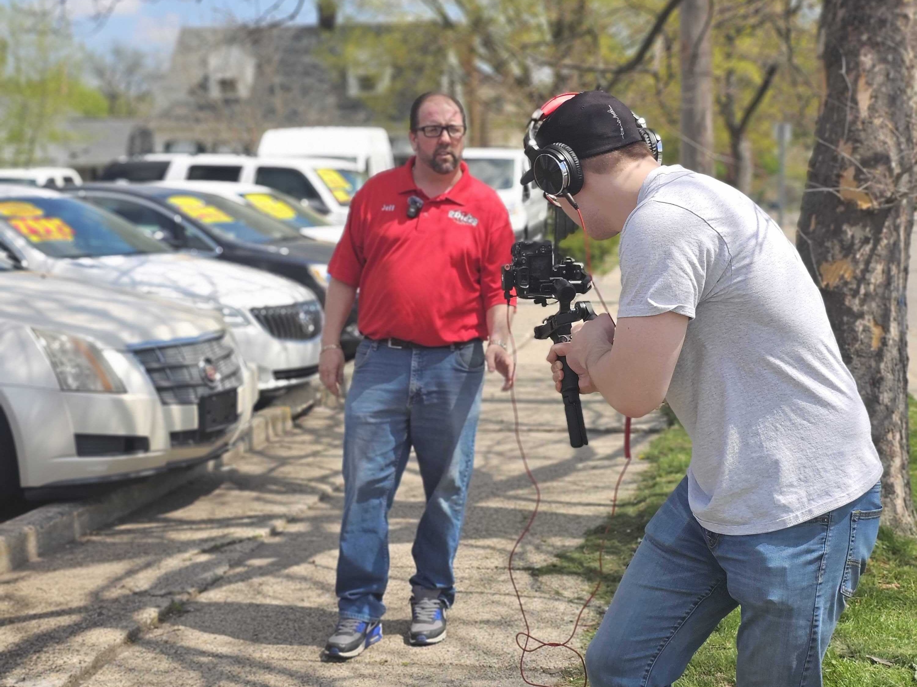 Videographer Zack capturing content for dealership client