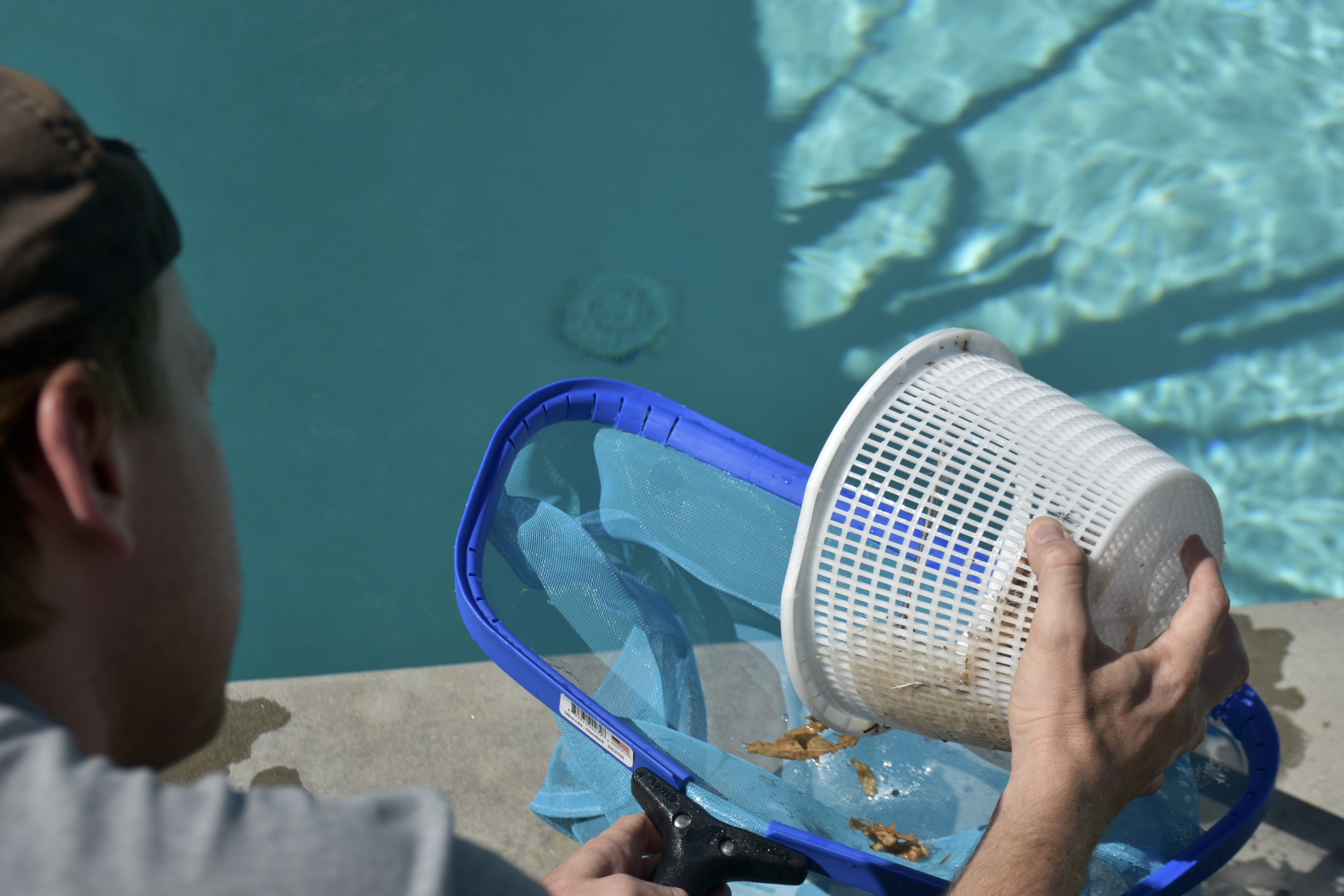 Close-up of a sparkling pool surface with clean tiles, representing professional pool cleaning service.