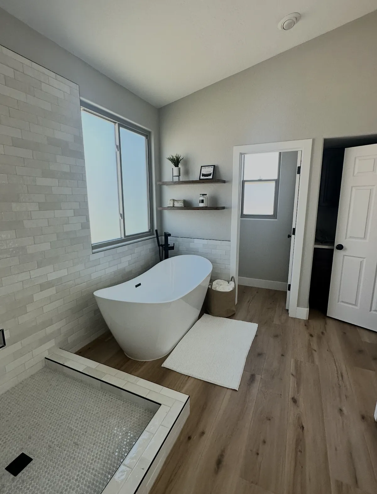 bathroom remodel with a shwer with 4" curb and LVP flooring installed by ACR