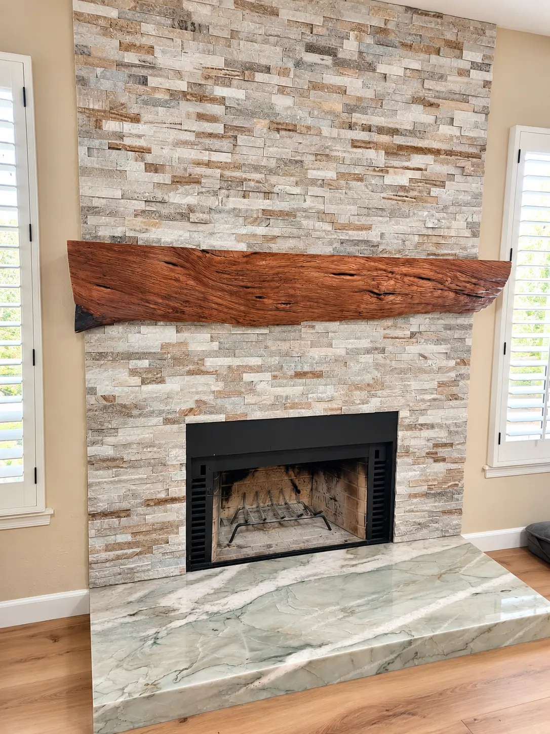Custom stacked stone fireplace with mantel