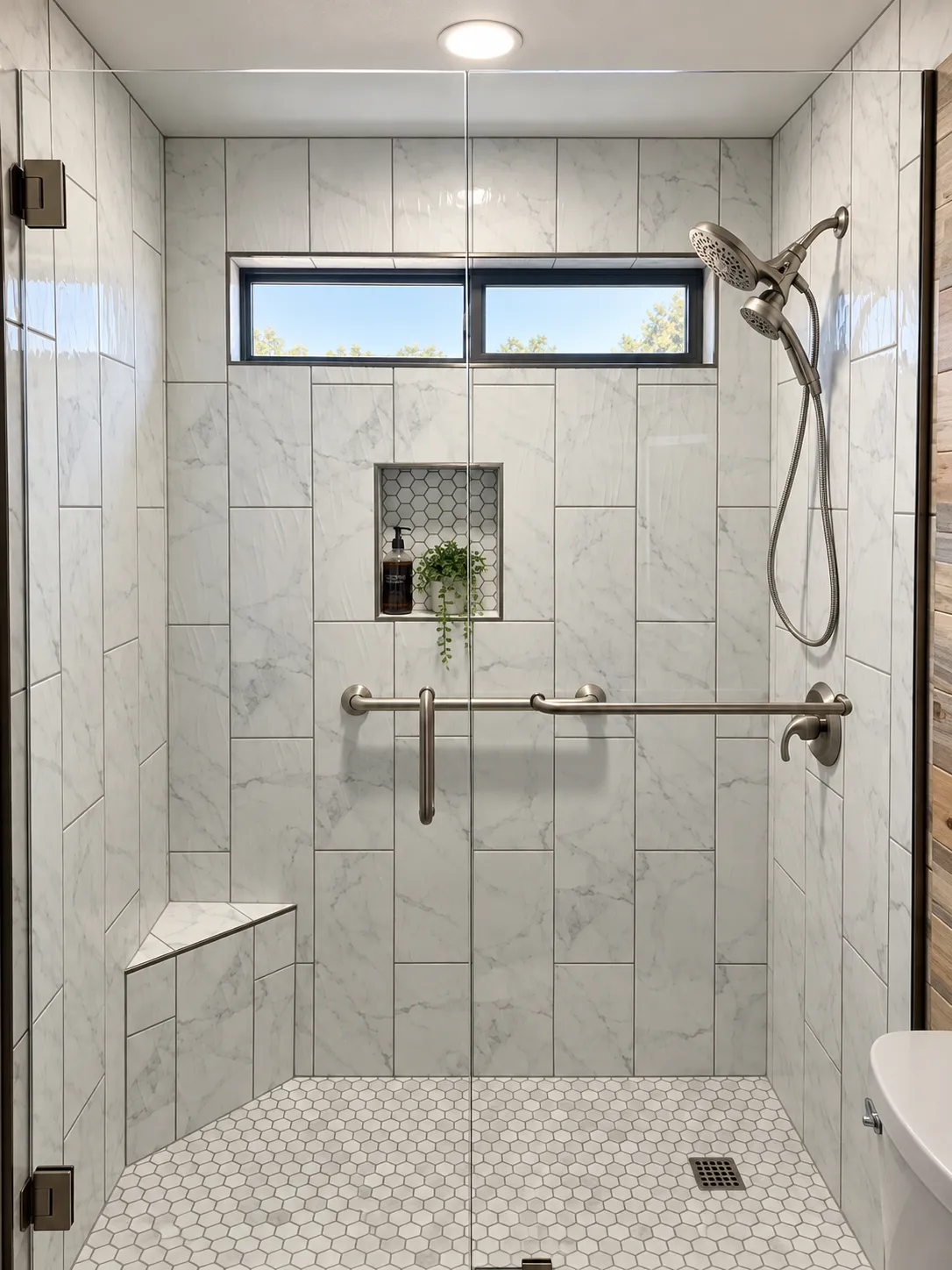 Shower remodel with corner bench, and niche, tile laid vertically, and glass barn doors