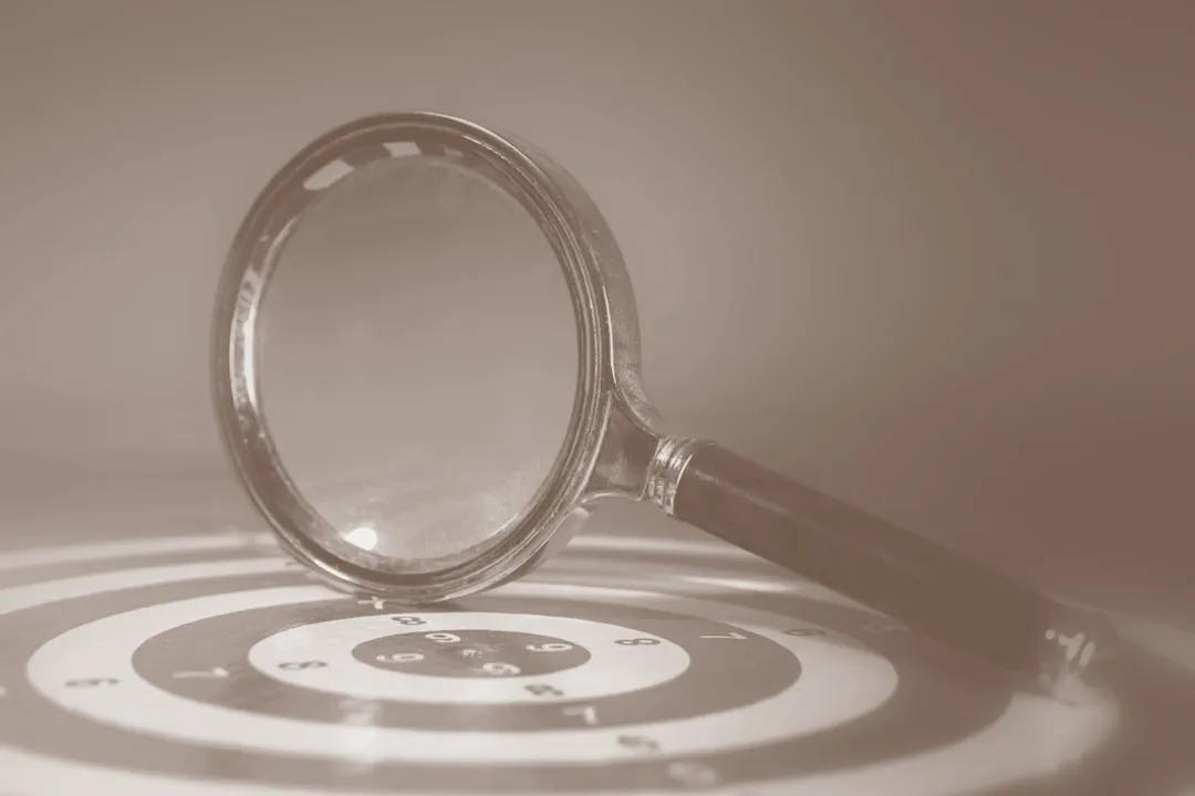 Magnifying glass over a target