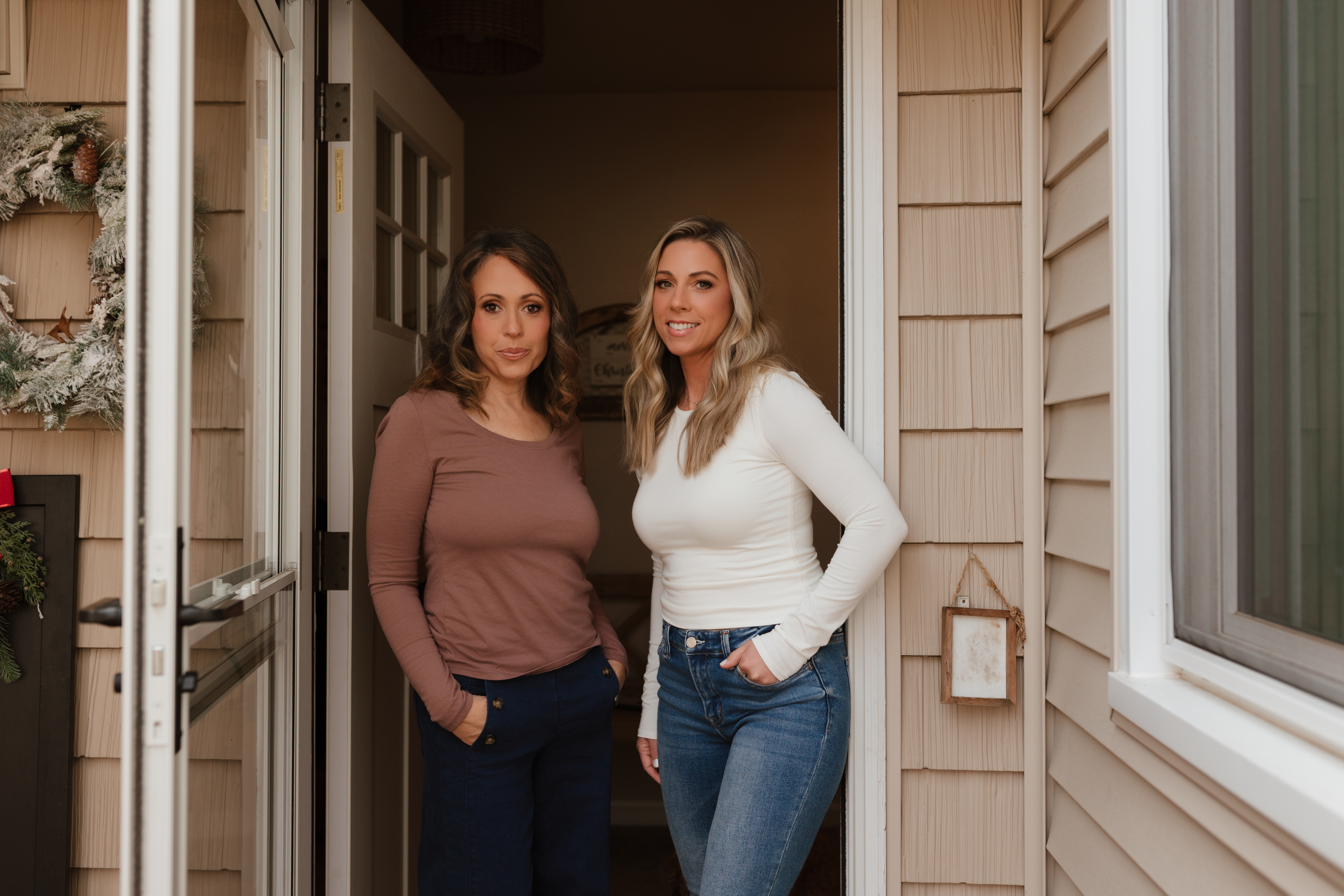 Portrait of Pamela, a mid-30s professional woman in a relaxed pose in a neutral-toned environment.